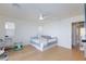 Bright bedroom features light wood floors, white walls, and a ceiling fan at 4066 Painted Lady Ave, Las Vegas, NV 89141