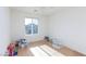 This bedroom has a fan, lots of light and light wood floors at 4066 Painted Lady Ave, Las Vegas, NV 89141