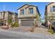 Attractive two-story home with a brick driveway, two-car garage, and easily maintained desert landscaping at 4066 Painted Lady Ave, Las Vegas, NV 89141