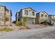 Charming two-story home featuring a brick driveway, attached two-car garage and low maintenance landscaping at 4066 Painted Lady Ave, Las Vegas, NV 89141