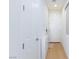 Clean, bright hallway with wood floors and white doors at 4066 Painted Lady Ave, Las Vegas, NV 89141