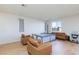 A cozy living room area with beautiful floors, lots of natural light, and contemporary furnishings at 4066 Painted Lady Ave, Las Vegas, NV 89141