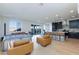Bright living space with hardwood floors, an open layout, and sliding glass doors to the backyard patio at 4066 Painted Lady Ave, Las Vegas, NV 89141