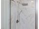 This shower features white marble style tiles and modern fixtures at 4066 Painted Lady Ave, Las Vegas, NV 89141