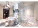 Elegant bathroom featuring double sinks, marble finishes, and modern fixtures at 4381 W Flamingo Rd # 2308, Las Vegas, NV 89103