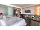 Bright bedroom showcases a clean design with a mounted TV and a workspace at 4381 W Flamingo Rd # 2308, Las Vegas, NV 89103