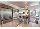 Sleek kitchen with stainless steel appliances and a breakfast bar, offering a modern urban living experience at 4381 W Flamingo Rd # 2308, Las Vegas, NV 89103