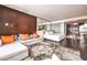 Open living area with modern furnishings, including a sofa and a bedroom at 4381 W Flamingo Rd # 2308, Las Vegas, NV 89103