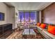 Bright living room featuring comfortable seating, a glass table, and city views at 4381 W Flamingo Rd # 2308, Las Vegas, NV 89103