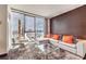 Stylish living room with floor-to-ceiling windows offering expansive city views at 4381 W Flamingo Rd # 2308, Las Vegas, NV 89103
