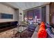Chic living room featuring modern furnishings and a stunning city view through floor-to-ceiling windows at 4381 W Flamingo Rd # 2308, Las Vegas, NV 89103