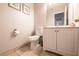 Cozy bathroom featuring neutral walls, tile flooring, toilet, vanity and sink at 4535 Sparwood Dr, Las Vegas, NV 89147