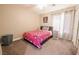 Well-lit bedroom with a twin bed, ample sunlight, and storage options for comfortable living at 4535 Sparwood Dr, Las Vegas, NV 89147