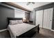 Bedroom with a queen bed, neutral walls, desk, and closet with sliding doors at 4535 Sparwood Dr, Las Vegas, NV 89147