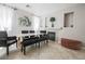 Elegant dining room with stylish chairs, a fireplace, and plenty of natural light at 4535 Sparwood Dr, Las Vegas, NV 89147