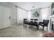 Bright dining area featuring modern decor, tile flooring, and ample space for entertaining at 4535 Sparwood Dr, Las Vegas, NV 89147