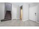 Spacious entryway with tile flooring, staircase, and entry door at 4535 Sparwood Dr, Las Vegas, NV 89147