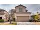 Inviting two-story home with a well-maintained front yard and a two-car garage at 4535 Sparwood Dr, Las Vegas, NV 89147