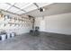 Spacious garage with ample shelving and a clean, well-maintained concrete floor, perfect for storage and projects at 4535 Sparwood Dr, Las Vegas, NV 89147