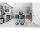 Modern kitchen featuring stainless steel appliances, ample counter space, and a breakfast bar at 4535 Sparwood Dr, Las Vegas, NV 89147