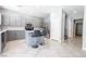 Contemporary kitchen with gray cabinets, a center island, and stainless steel appliances at 4535 Sparwood Dr, Las Vegas, NV 89147