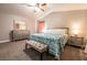 Cozy main bedroom with carpet, a ceiling fan, and a decorative bench at 4535 Sparwood Dr, Las Vegas, NV 89147