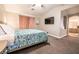 Spacious main bedroom with a TV, vaulted ceiling, and an ensuite bath at 4535 Sparwood Dr, Las Vegas, NV 89147