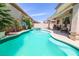 Stunning pool with a built-in spa and covered patio with ceiling fans, perfect for summer relaxation at 4535 Sparwood Dr, Las Vegas, NV 89147
