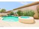 Relaxing pool and spa area surrounded by lush landscaping and a private backyard, great for outdoor enjoyment at 4535 Sparwood Dr, Las Vegas, NV 89147