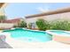Inviting backyard pool and spa surrounded by lush greenery offering a private and relaxing oasis at 4535 Sparwood Dr, Las Vegas, NV 89147