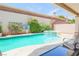 Lovely backyard pool and spa surrounded by mature landscaping, creating a serene outdoor living space at 4535 Sparwood Dr, Las Vegas, NV 89147