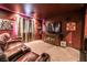 Home theater with red walls, plush seating, and a large screen for entertainment at 4535 Sparwood Dr, Las Vegas, NV 89147