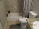 Bathroom featuring a tub and shower combination with neutral tile surround at 5038 S Rainbow Blvd # 206, Las Vegas, NV 89118
