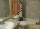 Bathroom featuring a tub and shower combination with neutral tile surround and updated sink at 5038 S Rainbow Blvd # 206, Las Vegas, NV 89118