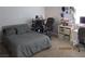 Cozy bedroom featuring modern decor, a comfortable bed and ample workspace at 5038 S Rainbow Blvd # 206, Las Vegas, NV 89118