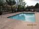 Inviting community pool with a concrete deck and metal safety fence at 5038 S Rainbow Blvd # 206, Las Vegas, NV 89118