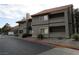 Apartment building with balconies and desert landscaping in front at 5038 S Rainbow Blvd # 206, Las Vegas, NV 89118