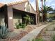 Exterior of leasing center with palm trees and rock landscaping and a paved walkway with entrance to leasing office at 5038 S Rainbow Blvd # 206, Las Vegas, NV 89118