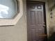 Close-up of a unit's front door with visible unit number and stucco exterior at 5038 S Rainbow Blvd # 206, Las Vegas, NV 89118