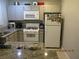 Well-equipped kitchen with granite countertops, white appliances, and ample cabinet space at 5038 S Rainbow Blvd # 206, Las Vegas, NV 89118