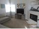 Cozy living room with a fireplace, comfortable seating, and natural light at 5038 S Rainbow Blvd # 206, Las Vegas, NV 89118