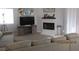 Comfortable living room featuring neutral tones, plush sofas, and a fireplace at 5038 S Rainbow Blvd # 206, Las Vegas, NV 89118