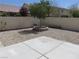 Backyard featuring a stone planter, concrete patio, and gravel landscaping, perfect for outdoor enjoyment at 5240 Sweet William St, North Las Vegas, NV 89081
