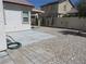 Backyard featuring a concrete patio, gravel landscaping, and perimeter foliage, offering a private retreat at 5240 Sweet William St, North Las Vegas, NV 89081