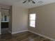 Comfortable bedroom with hardwood floors and convenient access to the bathroom at 5240 Sweet William St, North Las Vegas, NV 89081