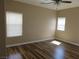 Cozy bedroom with natural light, hardwood floors, and ceiling fan at 5240 Sweet William St, North Las Vegas, NV 89081