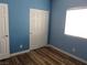 Bedroom with laminate floors, closet and window at 5240 Sweet William St, North Las Vegas, NV 89081