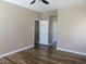 Bright bedroom with hardwood floors, neutral paint, and a ceiling fan at 5240 Sweet William St, North Las Vegas, NV 89081
