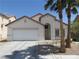 Charming single-story home featuring a two-car garage and desert landscaping at 5240 Sweet William St, North Las Vegas, NV 89081