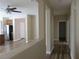 Hallway with neutral colors and laminate flooring leading to the kitchen and other rooms at 5240 Sweet William St, North Las Vegas, NV 89081